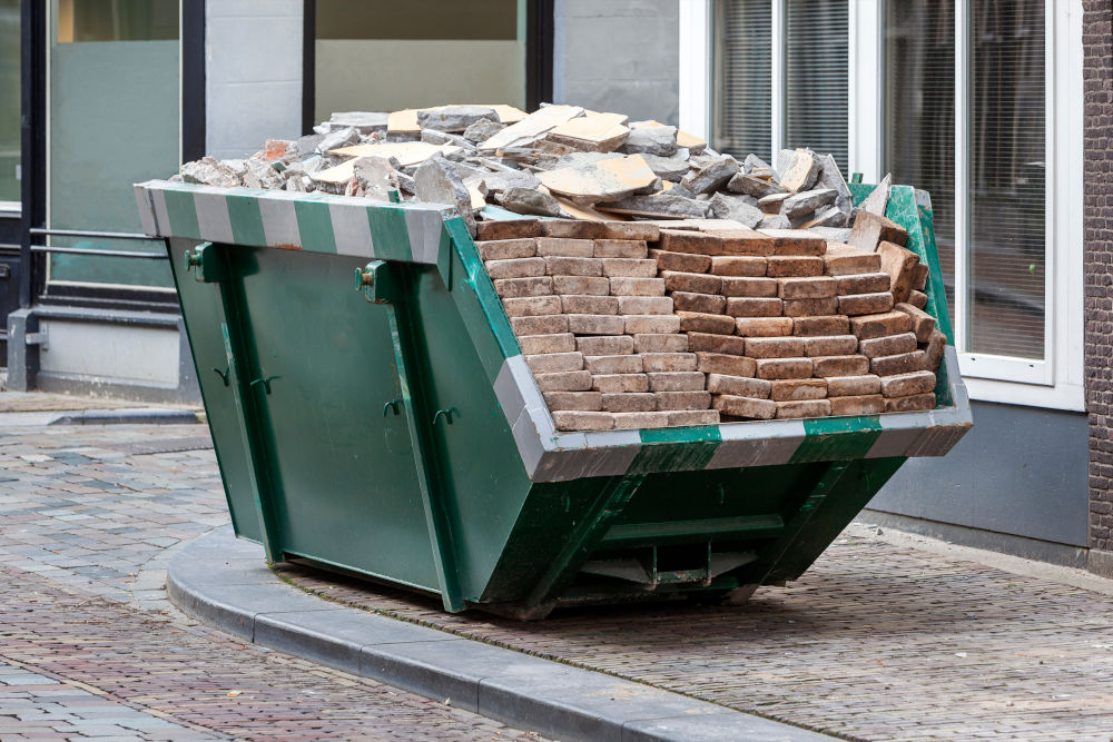 Green Skip with Neatly Layered Bricks