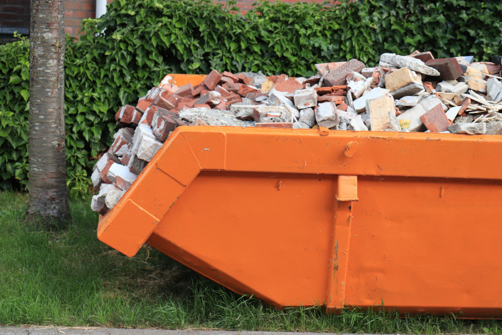 Orange Skip Full of Bricks