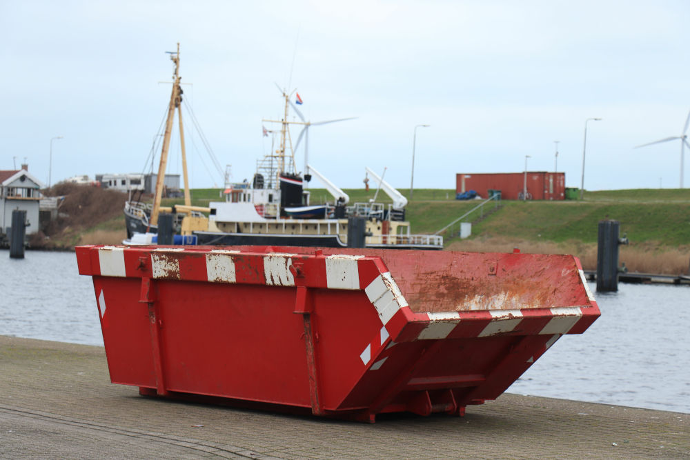 Red industrial Skip hire by the River