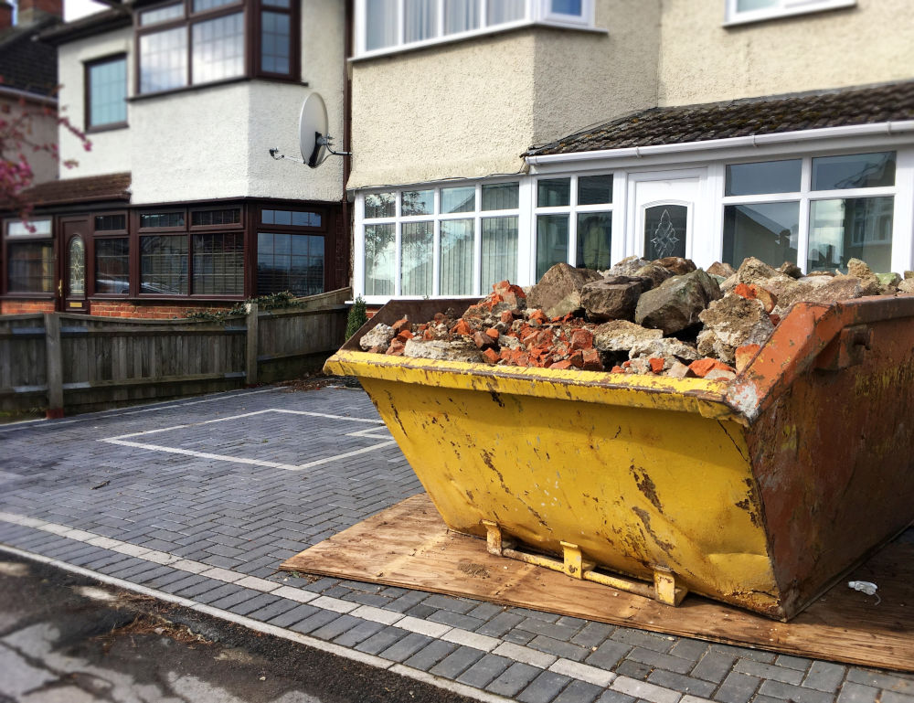 Yellow Skip Outside House